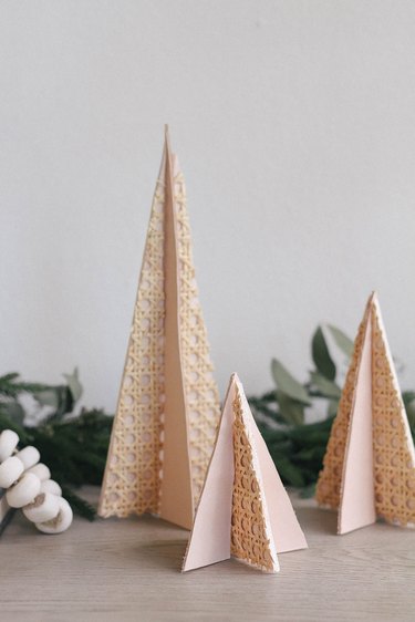 diy modern mini christmas trees made with cane webbing and leather