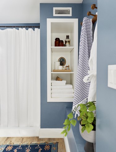 Bathroom closet organization by Emily Henderson