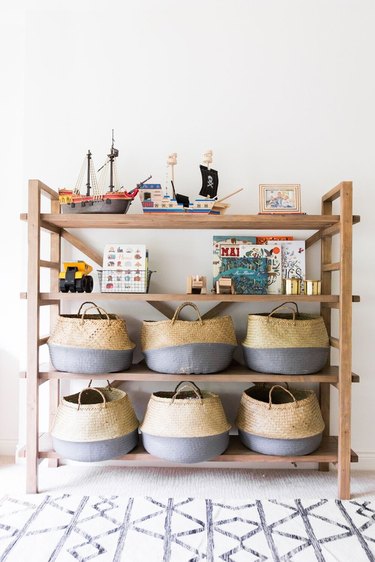 Playroom Organization Ideas with shelving unit filled with baskets