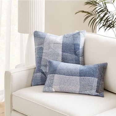 couch with two denim pillows