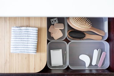 Toiletries in containers in drawer