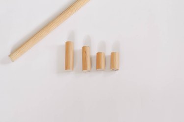 Wood dowel cut into small segments for wooden dolls