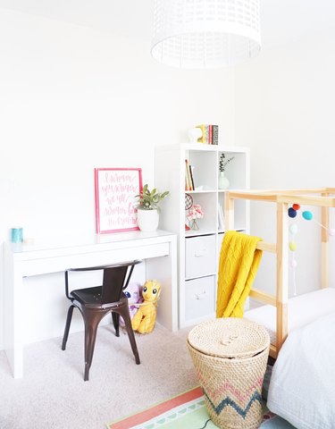 Kids' room organization with white walls, desk area, and bookshelf with cubbies