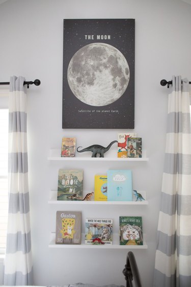 Kids' room organization  with floating bookshelves and moon poster