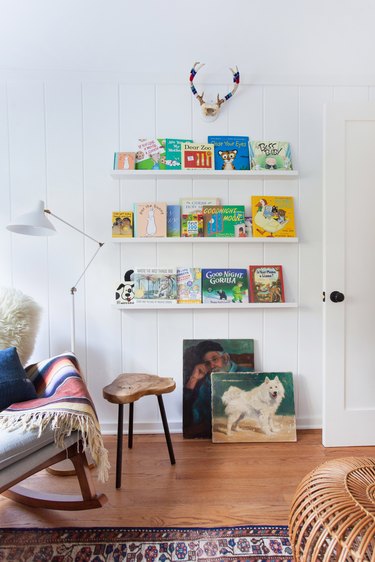 kids' book storage idea on white walls