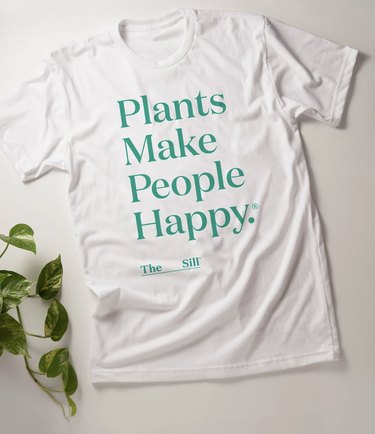 white shirt with text that reads "plants make people happy"