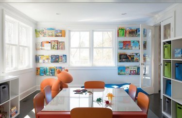 colorful playroom with acrylic kids' book storage idea
