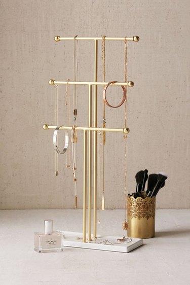 tiered jewelry organizer with hanging necklaces