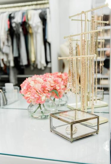 jewelry organizer idea with gold necklace stand