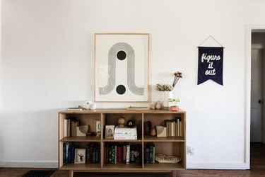 Wood bookcase with framed Block Shop print