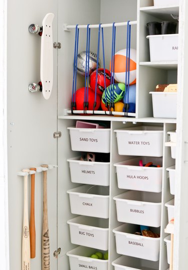 DIY garage organization idea with cabinet with labeled bins