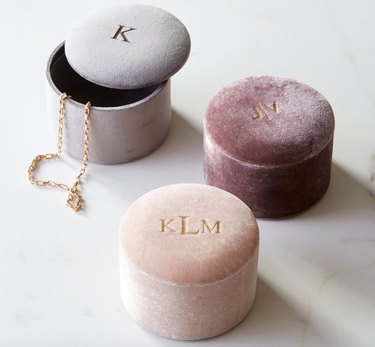 Earring Storage with Round velvet jewelry boxes in rose, gray and pink.