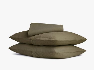 stacked olive pillowcases and sheet