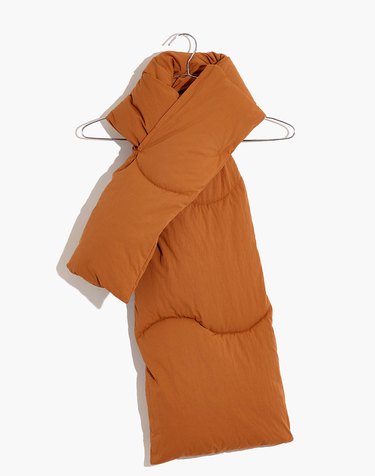 orange quilted Madewell x Buffy muffler wrapped around hanger