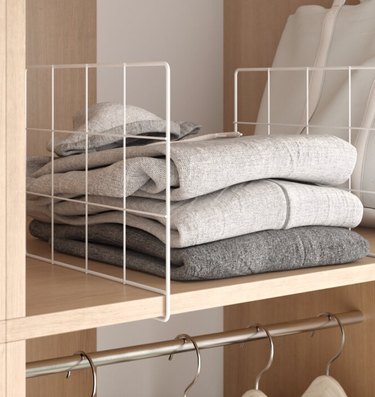 Closet Organizer with Sweaters on shelf with shelf divider.