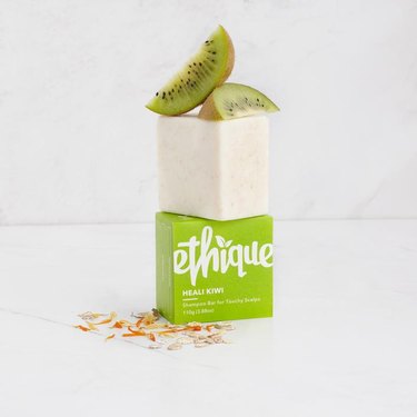 ethique heali kiwi shampoo bar with packaging, oats, and kiwi