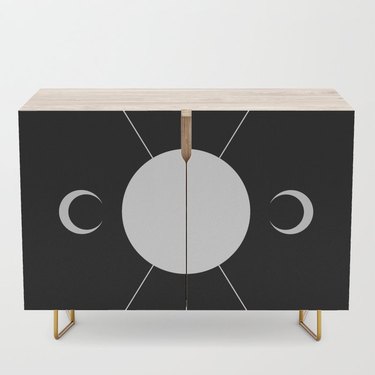 moon-inspired Credenza in black and birch with steel legs