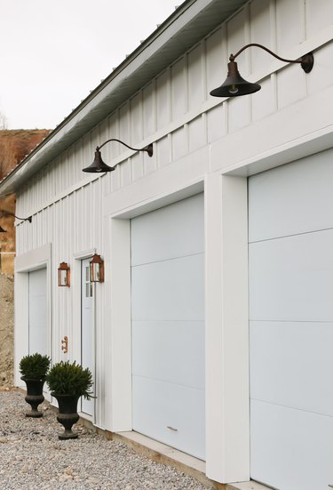 gray and white exterior with white garage doors