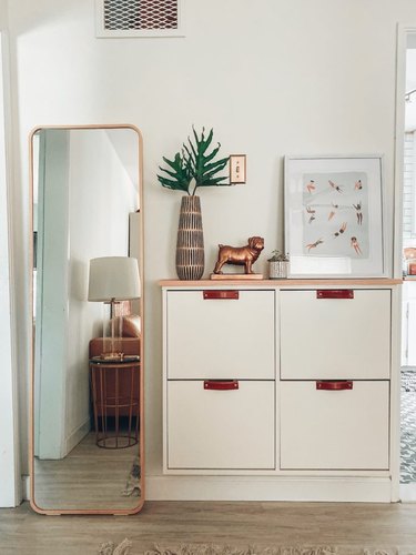 IKEA built-in entryway shoe storage with drawers and decorative tabletop pieces