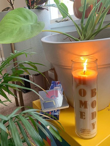 candle near table and plants