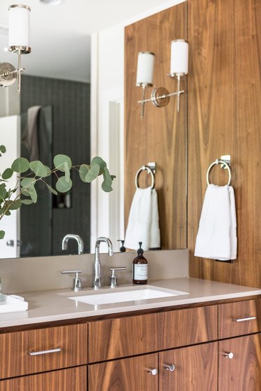 Bathroom designed by Studio Ten 25 with chrome faucet