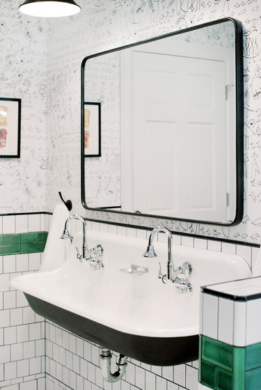 Bathroom designed by Etch Design Group with chrome faucet