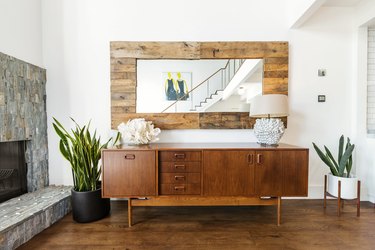 living room with fireplace and credenza