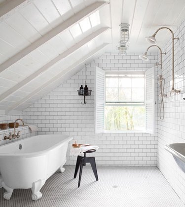 all white bathroom with floor to ceiling tile