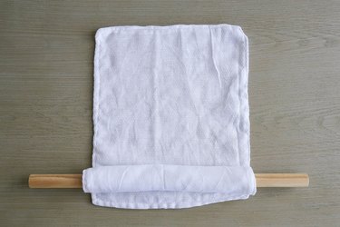 Rolling fabric unpaper towels around dowel