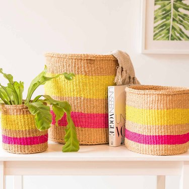 The Basket Room Mazao Woven Storage Basket on table with book and plant