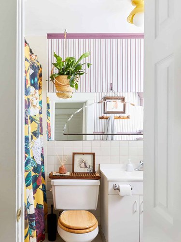 purple and white stripes wallpaper and floral shower curtain for bohemian shower