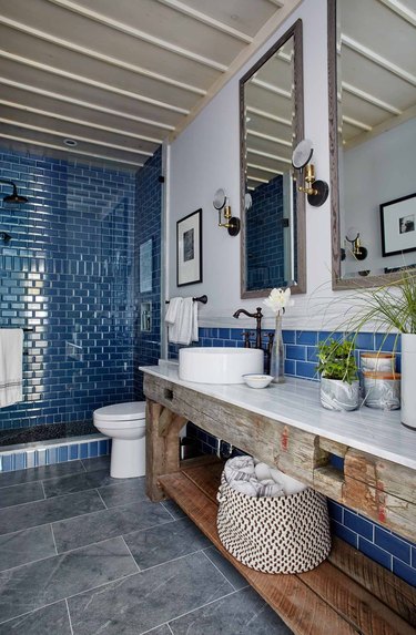 Blue shower tile in a shade of navy in farmhouse bathroom