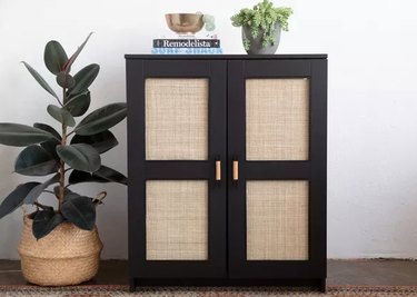 Black and cane IKEA cabinet