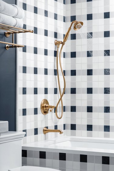 Plaid white and blue shower tile in farmhouse bathroom