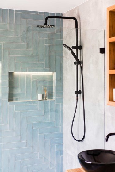 Blue shower tile in a shade of aqua in a modern shower