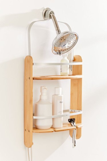 Wood and metal best shower caddes, shower head, shampoos and soaps.
