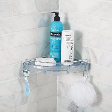 Corner best shower caddies, shampoo, razor, scrub, subway tile.