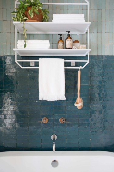 teal shower tile with light blue tile above it