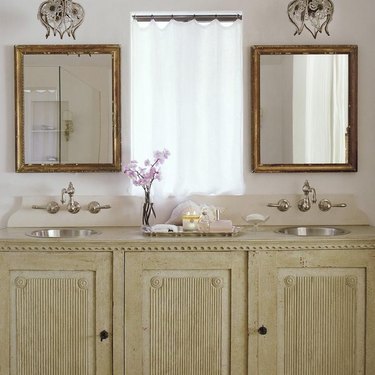 Bathroom with stainless steel bathroom sink designed by Giannetti Home