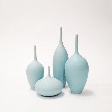 four blue vases