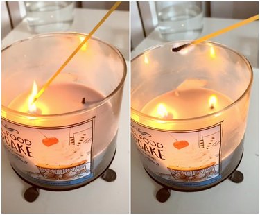 bath and body works candle being lit using strand of spaghetti