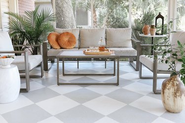 DIY painted gray and white checkerboard floor in sunroom