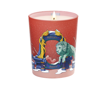 red candle with lion on the front