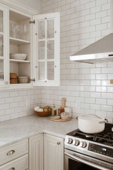 kitchen subway tile backsplash and white cabinets