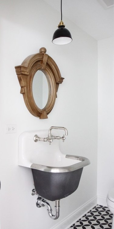 Bathroom with stainless steel bathroom sink by Park and Oak Interior Design