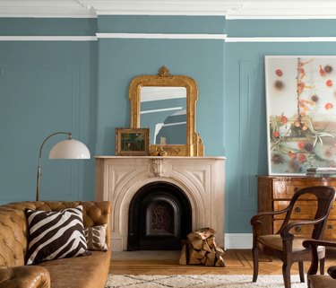 Benjamin Moore’s color of the year Aegean Teal in living room with fireplace