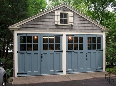 gray garage with blue carriage style garage doors
