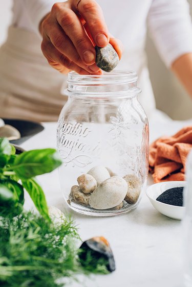 Use rocks to avoid overwatering your indoor herb garden