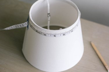 Measuring and marking dots around rim of lampshade