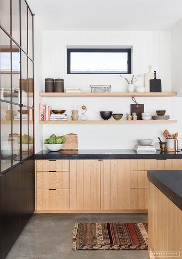 modern kitchen with wooden beadboard cabinets and open shelving